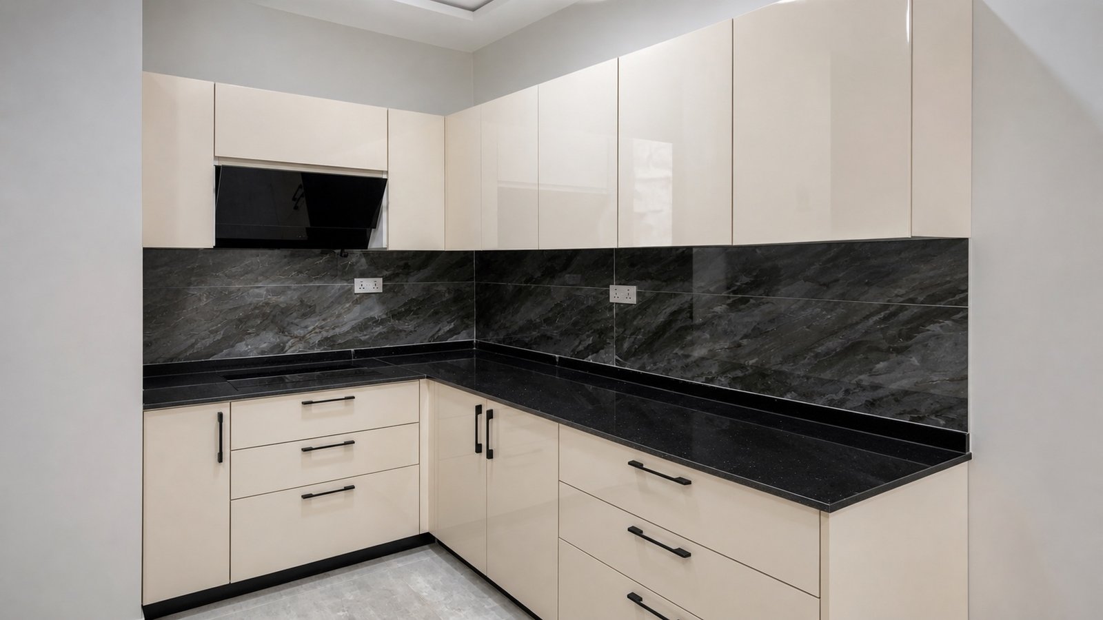 Ivory cabinetry against black stone